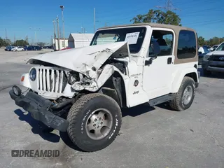 2001 Jeep Wrangler Sahara with VIN 1J4FA59S51P332107, listed as a IAAI auction lot 40954726 with 150,671 mi miles. Bid and sale history available at carsss.com. Image 17.