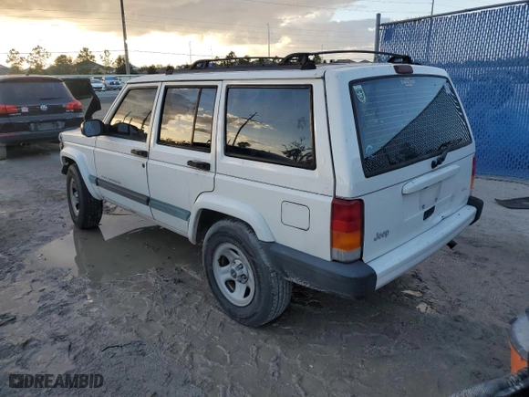 1999 Jeep Cherokee Sport with VIN 1J4FT68S6XL578679, listed as a Copart auction lot 76697394 with 196,110 mi miles and Salvage Title. Bid and sale history available at carsss.com. Image 2.