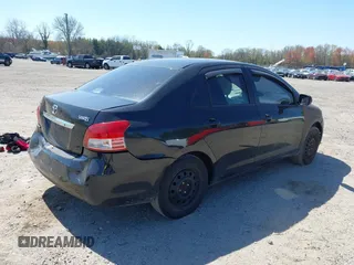 2009 Toyota Yaris with VIN JTDBT903294057773, listed as a IAAI auction lot 42071027 with 164,128 mi miles. Bid and sale history available at carsss.com. Image 4.