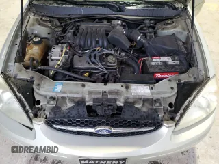2003 Ford Taurus SE Standard z VIN 1FAFP532X3A195612, wystawiony jako Copart lot #54016645 z przebiegiem 143 168 mil mil oraz Szkoda całkowita • Salvage title. Historia ofert i sprzedaży dostępna na DreamBid. Obrazek 11.