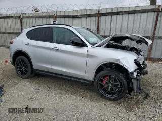 2019 Alfa Romeo Stelvio z VIN ZASPAJAN0K7C71850, wystawiony jako Copart lot #54234205 z przebiegiem Nie podano mil oraz Szkoda całkowita • Salvage title. Historia ofert i sprzedaży dostępna na DreamBid. Obrazek 4.