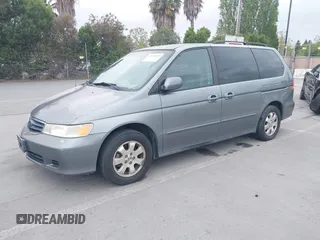 2002 Honda Odyssey EX-L z VIN 2HKRL18922H542116, wystawiony jako IAAI lot #42130335 z przebiegiem 205 053 mil mil oraz . Historia ofert i sprzedaży dostępna na DreamBid. Obrazek 2.