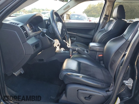 2008 Jeep Grand Cherokee SRT-8 with VIN 1J8HR78368C152318, listed as a Copart auction lot 74203604 with 157,840 mi miles and Salvage Title. Bid and sale history available at carsss.com. Image 7.