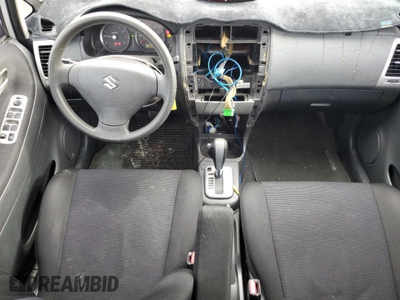 2006 Suzuki Aerio Premium z VIN JS2RC62H265351207, wystawiony jako Copart lot #74980534 z przebiegiem 64 199 mil mil oraz Nie do naprawy • Non repairable. Historia ofert i sprzedaży dostępna na DreamBid. Obrazek 8.
