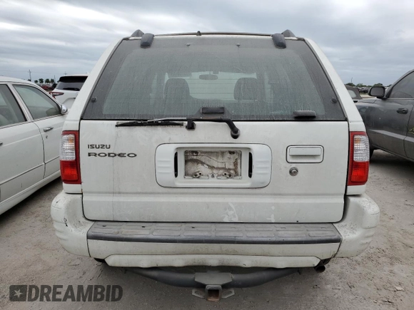 2002 Isuzu Rodeo S with VIN 4S2DM58W324327147, listed as a Copart auction lot 75194104 with Not Provided miles and Salvage Title. Bid and sale history available at DreamBid. Image 6.