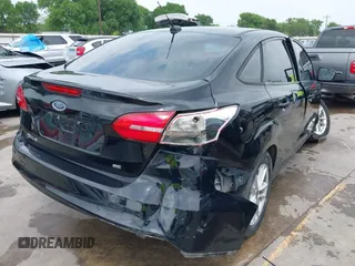 2018 Ford Focus SE with VIN 1FADP3F22JL311975, listed as a IAAI auction lot 41934856 with 68,974 mi miles. Bid and sale history available at carsss.com. Image 4.
