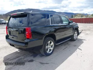 2017 Chevrolet Tahoe LT with VIN 1GNSKBKC5HR233537, listed as a IAAI auction lot 42051281 with 102,778 mi miles and . Bid and sale history available at DreamBid. Image 4.