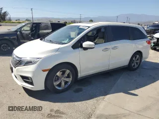 2018 Honda Odyssey EX-L z VIN 5FNRL6H7XJB010976, wystawiony jako Copart lot #57809005 z przebiegiem Nie podano mil oraz Szkoda całkowita • Salvage title. Historia ofert i sprzedaży dostępna na DreamBid. Obrazek 1.