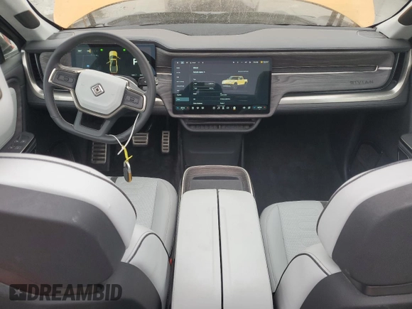 2022 Rivian R1T Launch Edition z VIN 7FCTGAAL2NN011755, wystawiony jako Copart lot #59934185 z przebiegiem 12 261 mil mil oraz Szkoda całkowita • Salvage title. Historia ofert i sprzedaży dostępna na DreamBid. Obrazek 8.