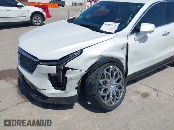 2024 Cadillac XT4 AWD Premium Luxury with VIN 1GYFZDR40RF100102, listed as a IAAI auction lot 41987175 with 4,935 mi miles and . Bid and sale history available at DreamBid. Image 6.