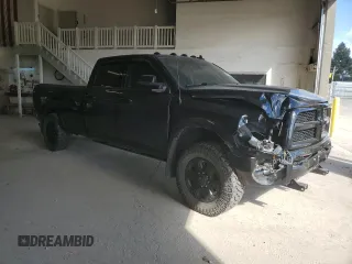 2014 Ram 3500 Laramie with VIN 3C63R3JL9EG258069, listed as a Copart auction lot 71571664 with 104,983 mi miles and Salvage Title. Bid and sale history available at carsss.com. Image 4.