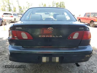 1999 Toyota Corolla VE with VIN 1NXBR12E7XZ240321, listed as a Copart auction lot 64259115 with 144,145 mi miles and Salvage title. Bid and sale history available at DreamBid. Image 6.
