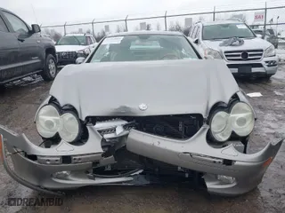 2005 Mercedes-Benz SL-Class 5.0L with VIN WDBSK75F35F099084, listed as a IAAI auction lot 41715942 with 114,880 mi miles. Bid and sale history available at carsss.com. Image 6.