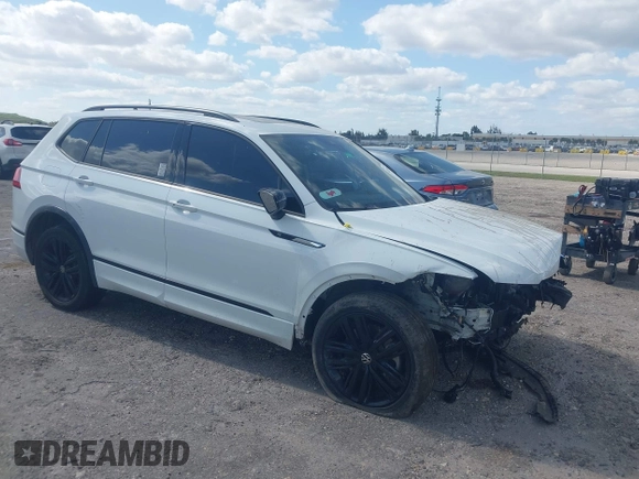 2022 Volkswagen Tiguan SE R-Line Black with VIN 3VVCB7AX5NM040222, listed as a IAAI auction lot 42073998 with 36,225 mi miles and . Bid and sale history available at DreamBid. Image 1.