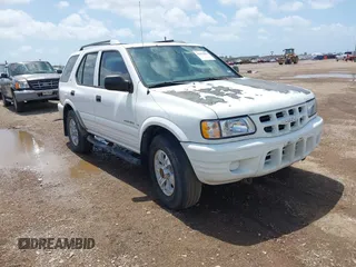 2001 Isuzu Rodeo S z VIN 4S2CK58W414357404, wystawiony jako IAAI lot #42479053 z przebiegiem Nie podano mil oraz . Historia ofert i sprzedaży dostępna na DreamBid. Obrazek 1.