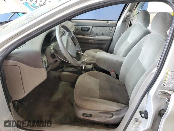 2005 Ford Taurus SE with VIN 1FAFP53215A133518, listed as a Copart auction lot 59615205 with 127,778 mi miles and Salvage title. Bid and sale history available at DreamBid. Image 7.