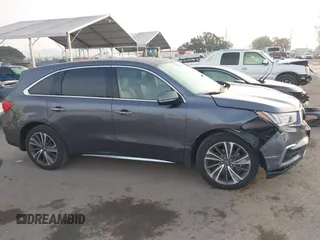 2019 Acura MDX Technology z VIN 5J8YD3H59KL010487, wystawiony jako IAAI lot #41478493 z przebiegiem 55 315 mil mil oraz . Historia ofert i sprzedaży dostępna na DreamBid. Obrazek 13.