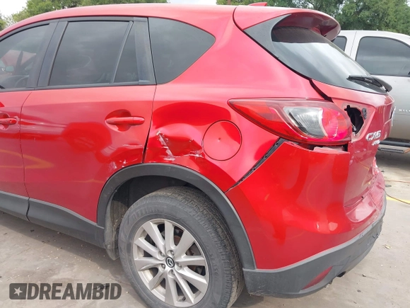 2015 Mazda CX-5 Touring with VIN JM3KE4CYXF0439953, listed as a IAAI auction lot 42124197 with 242,614 mi miles and . Bid and sale history available at DreamBid. Image 17.