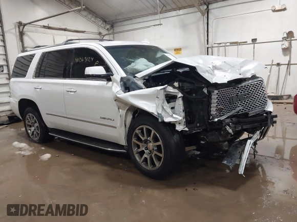 2016 GMC Yukon Denali with VIN 1GKS2CKJXGR271605, listed as a IAAI auction lot 41269124 with 172,432 mi miles. Bid and sale history available at carsss.com. Image 1.