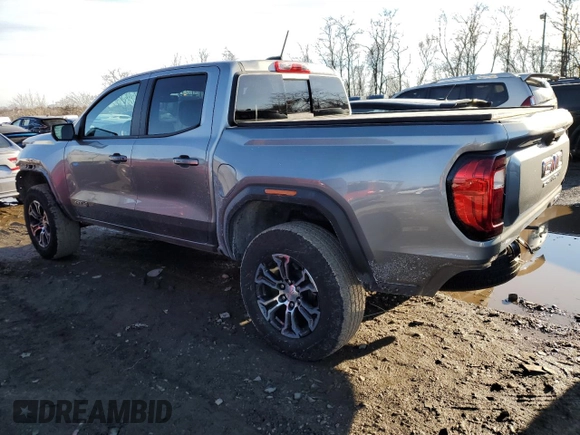 2023 GMC Canyon 4WD AT4 with VIN 1GTP6DEK5P1170230, listed as a Copart auction lot 42701935 with 26,704 mi miles and Salvage Title. Bid and sale history available at carsss.com. Image 2.