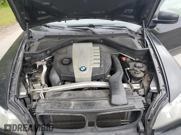 2012 BMW X5 35d with VIN 5UXZW0C54CL671377, listed as a Copart auction lot 60936395 with 105,903 mi miles and Salvage title. Bid and sale history available at DreamBid. Image 12.