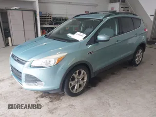 2013 Ford Escape SE with VIN 1FMCU0GX6DUC09872, listed as a IAAI auction lot 42020093 with 215,906 mi miles and . Bid and sale history available at DreamBid. Image 2.