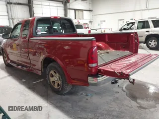 2002 Ford F-150 XL with VIN 1FTRX17L12NA36715, listed as a IAAI auction lot 41850555 with 174,012 mi miles. Bid and sale history available at carsss.com. Image 3.