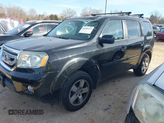 2011 Honda Pilot EX-L with VIN 5FNYF4H65BB053914, listed as a IAAI auction lot 41599171 with 230,186 mi miles and . Bid and sale history available at carsss.com. Image 2.