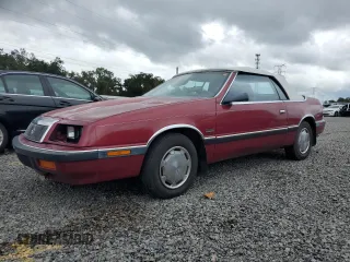 1989 Chrysler LeBaron z VIN 1C3XJ45J8KG223051, wystawiony jako Copart lot #75115464 z przebiegiem 27 923 mil mil oraz Szkody całkowita. Historia ofert i sprzedaży dostępna na DreamBid. Obrazek 1.
