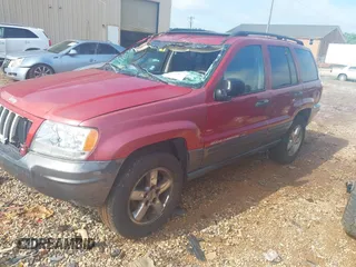 2004 Jeep Grand Cherokee Laredo with VIN 1J4GW48S34C419596, listed as a IAAI auction lot 42515494 with 276,196 mi miles and . Bid and sale history available at DreamBid. Image 2.