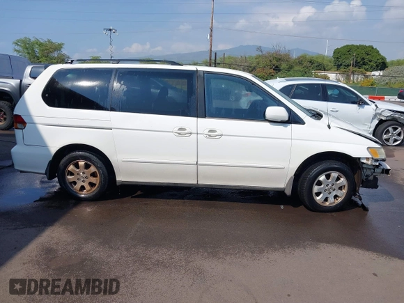 2002 Honda Odyssey EX z VIN 2HKRL18632H556791, wystawiony jako IAAI lot #41562553 z przebiegiem 222 976 mil mil oraz . Historia ofert i sprzedaży dostępna na DreamBid. Obrazek 14.