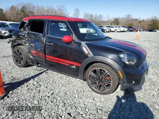 2014 MINI Countryman John Cooper Works with VIN WMWXD1C5XEWS34681, listed as a Copart auction lot 41781005 with 133,463 mi miles and Salvage Title. Bid and sale history available at DreamBid. Image 4.