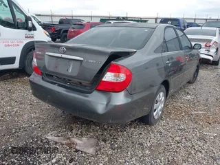2004 Toyota Camry LE with VIN 4T1BE32K64U868802, listed as a IAAI auction lot 42141061 with 254,215 mi miles. Bid and sale history available at carsss.com. Image 4.