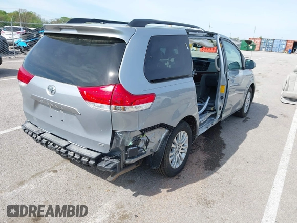 2014 Toyota Sienna XLE with VIN 5TDYK3DC0ES451307, listed as a IAAI auction lot 42093569 with 105,721 mi miles and . Bid and sale history available at DreamBid. Image 4.