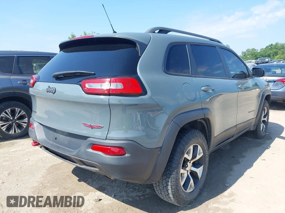 2014 Jeep Cherokee Trailhawk z VIN 1C4PJMBSXEW273520, wystawiony jako IAAI lot #42569063 z przebiegiem 137 585 mil mil oraz . Historia ofert i sprzedaży dostępna na DreamBid. Obrazek 4.