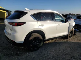 2022 Mazda CX-5 2.5 Turbo with VIN JM3KFBAY7N0597010, listed as a Copart auction lot 83062114 with 18,136 mi miles and Salvage Title. Bid and sale history available at carsss.com. Image 3.