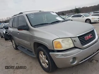 2002 GMC Envoy SLT with VIN 1GKDT13S522420800, listed as a IAAI auction lot 41624195 with 255,745 mi miles. Bid and sale history available at carsss.com. Image 1.