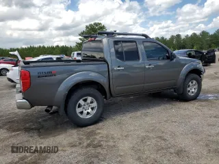 2008 Nissan Frontier SE with VIN 1N6AD07UX8C406795, listed as a Copart auction lot 61303185 with 145,742 mi miles and Salvage title. Bid and sale history available at DreamBid. Image 3.