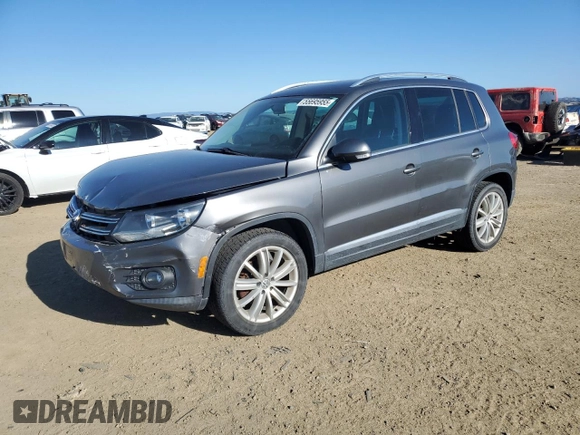 2014 Volkswagen Tiguan SEL with VIN WVGAV3AX0EW555873, listed as a Copart auction lot 55695955 with 69,984 mi miles and Salvage title. Bid and sale history available at DreamBid. Image 1.