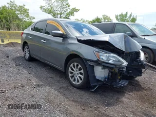 2019 Nissan Sentra S z VIN 3N1AB7AP1KY426293, wystawiony jako IAAI lot #42198199 z przebiegiem 104 905 mil mil oraz . Historia ofert i sprzedaży dostępna na DreamBid. Obrazek 1.