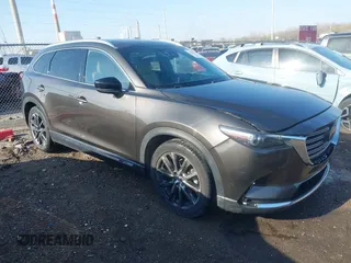 2016 Mazda CX-9 Grand Touring with VIN JM3TCBDY3G0104001, listed as a IAAI auction lot 41961054 with 77,057 mi miles and . Bid and sale history available at DreamBid. Image 1.