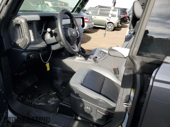 2024 Ford Bronco Big Bend z VIN 1FMDE7BH9RLA85832, wystawiony jako Copart lot #86171994 z przebiegiem 1 196 mil mil oraz Szkoda całkowita • Salvage title. Historia ofert i sprzedaży dostępna na DreamBid. Obrazek 7.