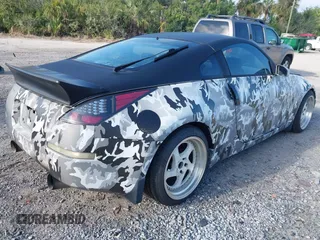 2004 Nissan 350Z Touring with VIN JN1AZ34D44T150578, listed as a IAAI auction lot 41907783 with 198,312 mi miles. Bid and sale history available at carsss.com. Image 4.