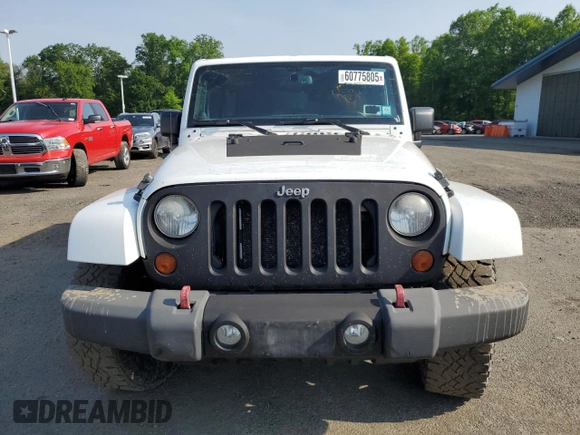 2013 Jeep Wrangler Unlimited Sport z VIN 1C4HJWDG9DL581643, wystawiony jako Copart lot #60775805 z przebiegiem 148 959 mil mil oraz Czysty tytuł • Clean title. Historia ofert i sprzedaży dostępna na DreamBid. Obrazek 5.