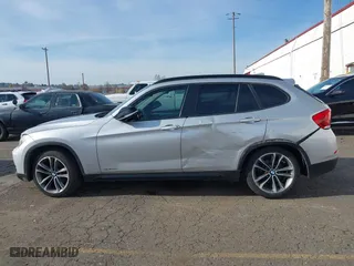 2014 BMW X1 sDrive28i with VIN WBAVM1C58EVW52847, listed as a IAAI auction lot 40779553 with 151,076 mi miles. Bid and sale history available at carsss.com. Image 14.