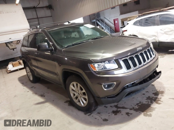 2014 Jeep Grand Cherokee Laredo with VIN 1C4RJEAG7EC145023, listed as a IAAI auction lot 40518825 with 115,098 mi miles and . Bid and sale history available at DreamBid. Image 1.