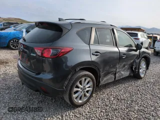 2015 Mazda CX-5 Grand Touring with VIN JM3KE4DY3F0495411, listed as a Copart auction lot 50077765 with 136,191 mi miles and Salvage Title. Bid and sale history available at DreamBid. Image 3.