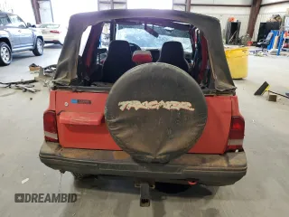 1994 Geo Tracker z VIN 2CNBE18U3R6952403, wystawiony jako Copart lot #79038524 z przebiegiem 271 461 mil mil oraz Szkody całkowita. Historia ofert i sprzedaży dostępna na DreamBid. Obrazek 6.