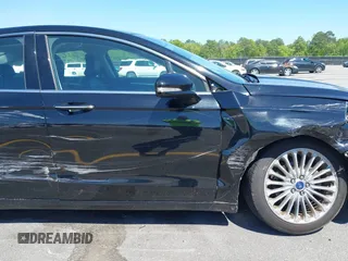 2016 Ford Fusion Titanium with VIN 3FA6P0K9XGR158234, listed as a IAAI auction lot 42043716 with 161,164 mi miles. Bid and sale history available at carsss.com. Image 17.