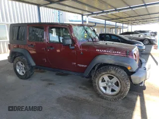 2010 Jeep Wrangler Unlimited Rubicon with VIN 1J4BA6H18AL197855, listed as a Copart auction lot 57748185 with 147,899 mi miles and Salvage title. Bid and sale history available at DreamBid. Image 4.